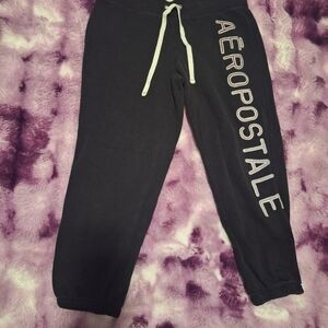 Womens black Aeropostale sweatpants with purple stiching